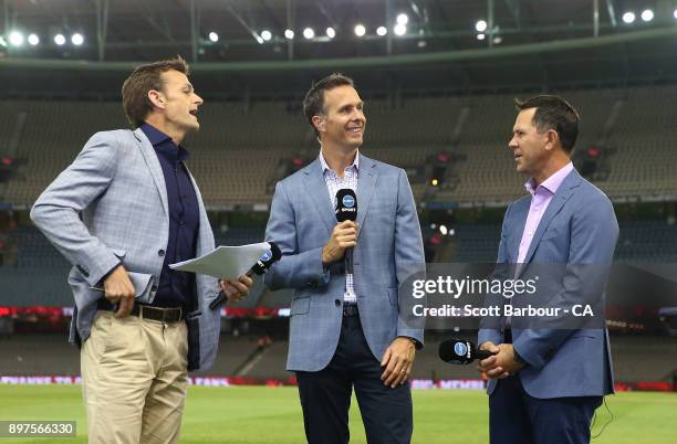 Network Ten commentators Adam Gilchrist, Michael Vaughan and Ricky Ponting look on during the Big Bash League match between the Melbourne Renegades...