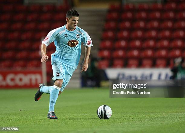 Ben Marshall of Northampton Town runs with the ball during the Carling Cup Round One Match between Southampton and Northampton Town at St Mary's...