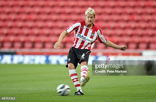 Dan Harding of Southampton runs with the ball during the Carling Cup Round One Match between Southampton and Northampton Town at St Mary's Stadium on...