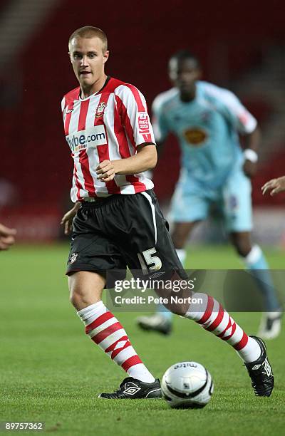 Olly Lancashire of Southampton runs with the ball during the Carling Cup Round One Match between Southampton and Northampton Town at St Mary's...
