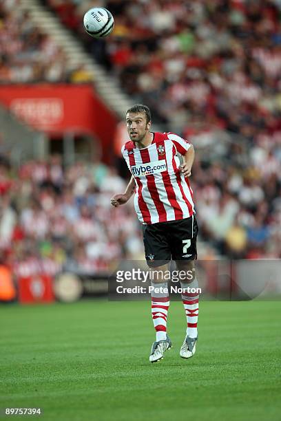 Rickie Lambert of Southampton heads the ball during the Carling Cup Round One Match between Southampton and Northampton Town at St Mary's Stadium on...