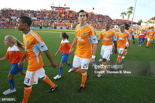 Geoff Cameron and teammates of the Houston Dynamo walk on the pitch before the game against the Chicago Fire at Robertson Stadium on August 9, 2009...