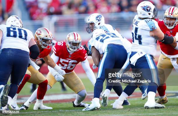 Reuben Foster and Brock Coyle of the San Francisco 49ers tackle DeMarco Murray of the Tennessee Titans during the game at Levi's Stadium on December...