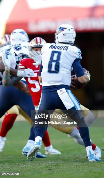 Brock Coyle of the San Francisco 49ers pressures Marcus Mariota of the Tennessee Titans during the game at Levi's Stadium on December 17, 2017 in...