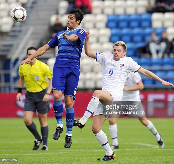French midfielder Yoann Gourcuff controls the ball in front Faroe's forward Suni Olsen during the World Cup 2010 qualifying football match France vs....