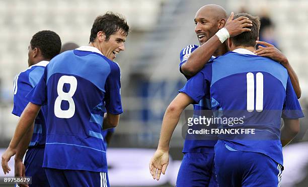 French forward Andre-Pierre Gignac is congratulated by teammates Nicolas Anelka and Yoann Gourcuff after scoring a goal during the World Cup 2010...