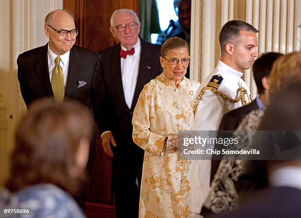 Georgetown Law Professor Martin D. Ginsburg accompanies his wife U.S. Supreme Court Associate Justice Ruth Bader Ginsburg with Associate Justice John...