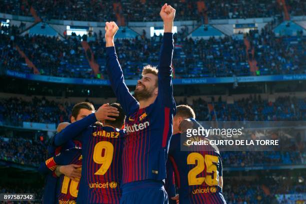 Barcelona's Spanish defender Gerard Pique celebrates after Barcelona's Spanish midfielder Aleix Vidal scored during the Spanish League "Clasico"...