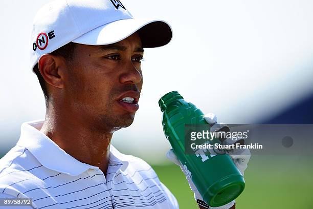 Tiger Woods has a drink during the third preview day of the 91st PGA Championship at Hazeltine National Golf Club on August 12, 2009 in Chaska,...