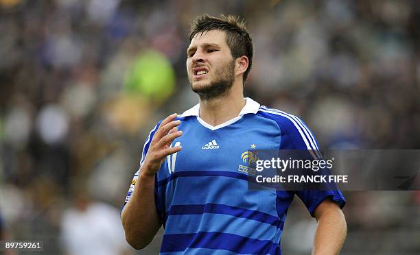 French forward Andre-Pierre Gignac reacts after missing a shot during the World Cup 2010 qualifying football match France vs. Faroe Islands, on...