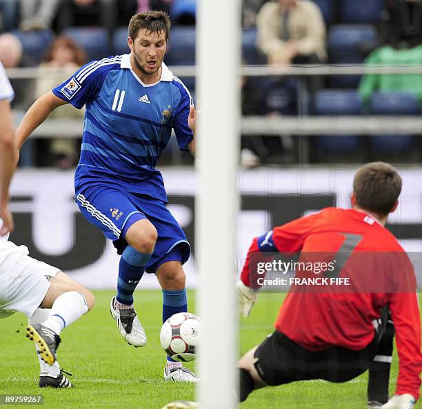 French forward Andre-Pierre Gignac challenges Faroe's goalkeeper Jakup Mikkelsen during the World Cup 2010 qualifying football match France vs. Faroe...