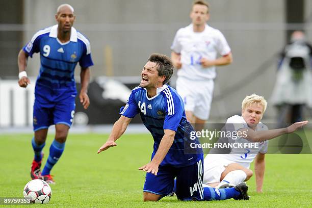French midfielder Jeremy Toulalan is tackled by Faroe's defender Johan Davidsen during the World Cup 2010 qualifying football match France vs. Faroe...
