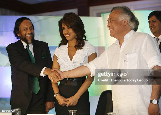 Minister for Environment and Forests, Jairam Ramesh shakes hand with Nobel Laureate and Director General of TERI, R.K. Pachauri along with Actress...