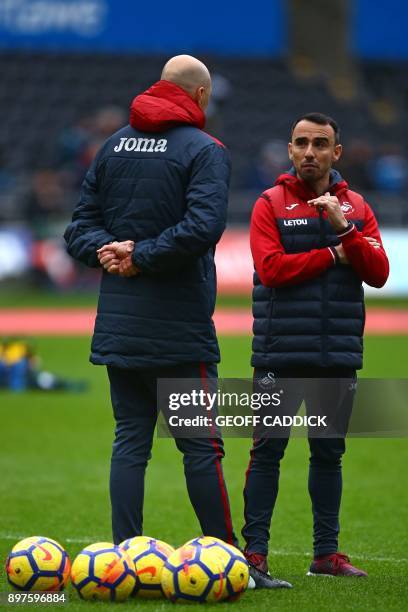 Swansea City's English midfielder Leon Britton , interim manager on the pitch ahead of the English Premier League football match between Swansea City...