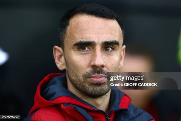 Swansea City's English midfielder Leon Britton, interim manager awaits kick off in the English Premier League football match between Swansea City and...