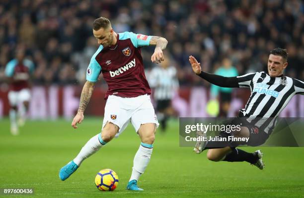 Marko Arnautovic of West Ham United scores his sides first goal during the Premier League match between West Ham United and Newcastle United at...