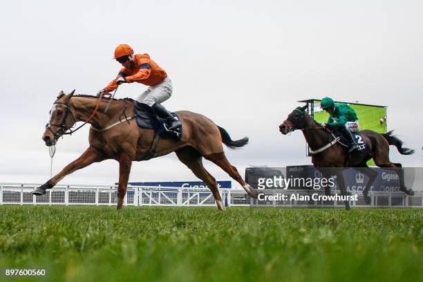 Joe Colliver riding Sam Spinner clear the last to win The JLT Reve De Sivola Long Walk Hurdle Race from LâAmi Serge at Ascot racecourse on December...