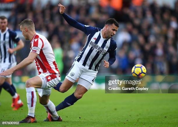 Hal Robson-Kanu of West Bromwich Albion is fouled by Ryan Shawcross of Stoke City during the Premier League match between Stoke City and West...