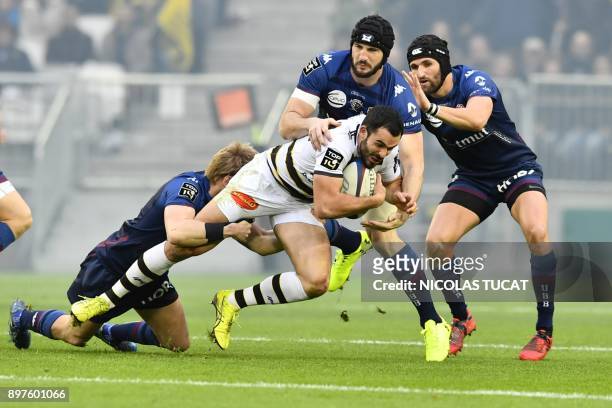 La Rochelle's French centre Geoffrey Doumayrou is tackled during the French Top 14 rugby union match between Bordeaux-Begles and La Rochelle on...