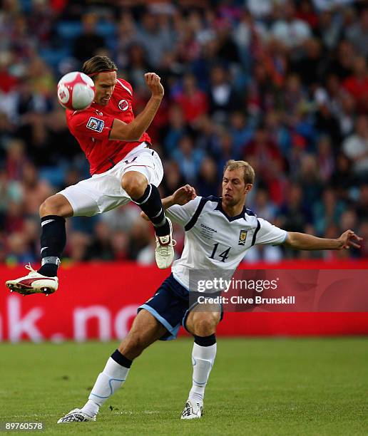 Thorstein Helstad of Norway in action with Steven Whittaker of Scotland during the FIFA 2010 group nine World Cup Qualifying match between Scotland...
