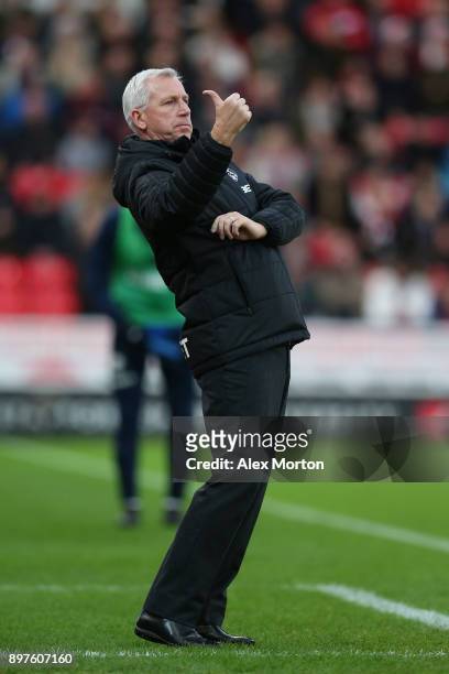 Alan Pardew, Manager of West Bromwich Albion gives his team instructions during the Premier League match between Stoke City and West Bromwich Albion...