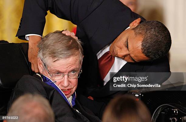 President Barack Obama presents the Medal of Freedom to physicist Stephen Hawking during a ceremony in the East Room of the White House August 12,...