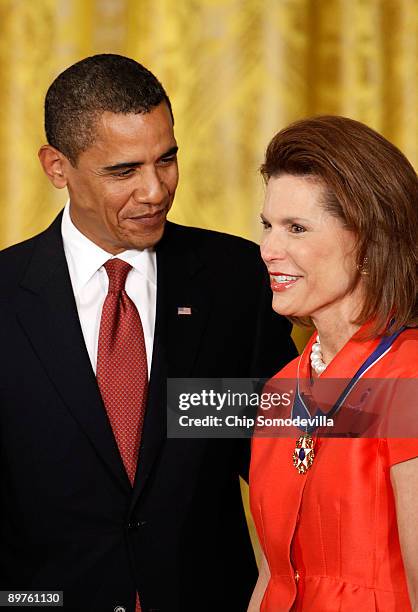 President Barack Obama presents the Medal of Freedom to Nancy Goodman Brinker, founder of the Susan G. Komen for the Cure, during a ceremony in the...