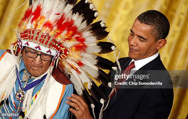 President Barack Obama presents the Medal of Freedom to Crow War Chief Dr. Joseph Medicine Crow � High Bird during a ceremony in the East Room of the...