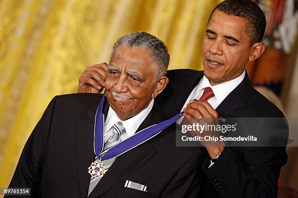 President Barack Obama presents the Medal of Freedom to civil rights pioneer Reverend Joseph E. Lowery during a ceremony in the East Room of the...