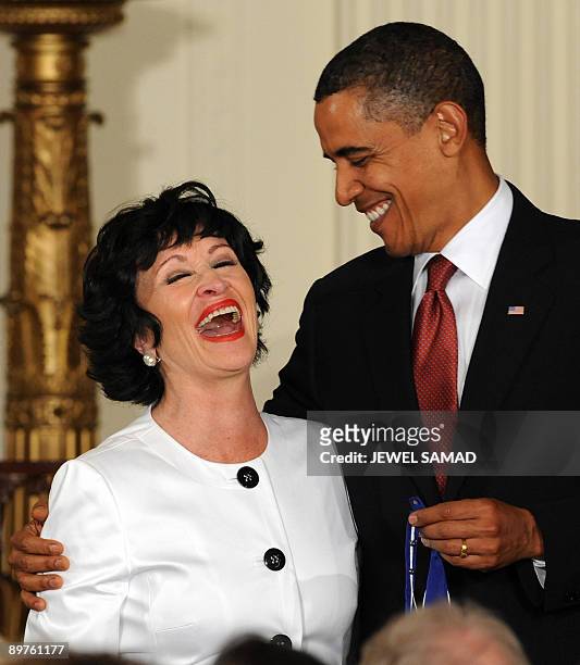 President Barack Obama smiles before presenting the Presidential Medal of Freedom to actress, singer and dancer Chita Rivera during a ceremony in the...