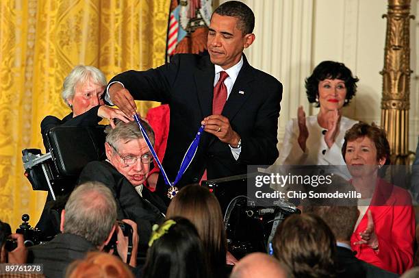 President Barack Obama presents the Medal of Freedom to physicist Stephen Hawking during a ceremony in the East Room of the White House August 12,...