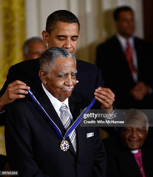 President Barack Obama presents the Medal of Freedom to Reverend Joseph E. Lowery during a ceremony at the White House August 12, 2009 in Washington,...