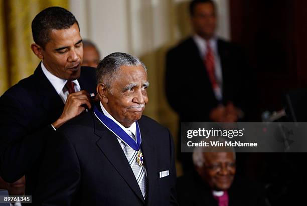 President Barack Obama presents the Medal of Freedom to Reverend Joseph E. Lowery during a ceremony at the White House August 12, 2009 in Washington,...