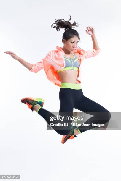 young female athlete jumping - china athlete woman stock pictures, royalty-free photos & images