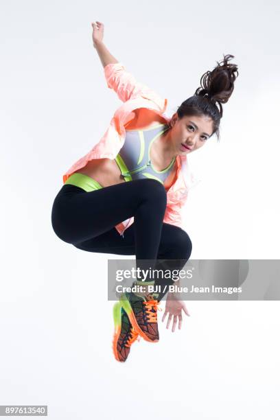 young female athlete jumping - china athlete woman stock pictures, royalty-free photos & images