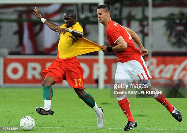 Austria's Stefan Maierhofer fights for the ball with Cameroon's Stephane Mbia during their friendly international football match in Klagenfurt on...