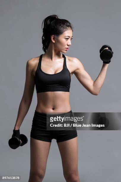 young female athlete exercising - china athlete woman stock pictures, royalty-free photos & images