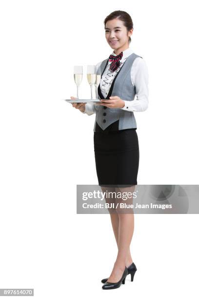 smiling waitress in hotel serving champagne - silver platter stock pictures, royalty-free photos & images