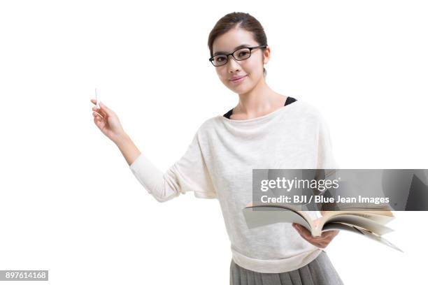 young female teacher teaching with textbook - trainer cutout stockfoto's en -beelden