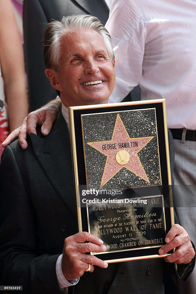 George Wc Hamilton George Hamilton poses after being honored on the Hollywood Walk Of ...