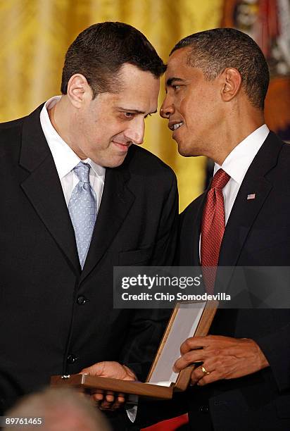 President Barack Obama presents the Medal of Freedom to Stuart Milk on behalf of her uncle, Harvey Bernard Milk, during a ceremony in the East Room...