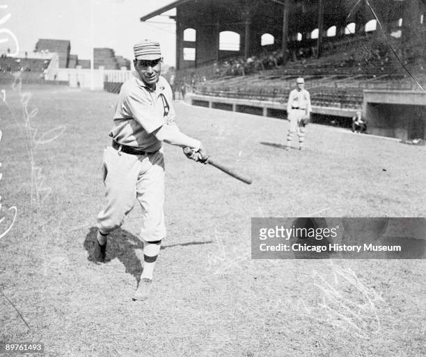 Informal full-length portrait of Hall of Fame baseball player Charles "Chief" Bender of the American League's Philadelphia Athletics, following...