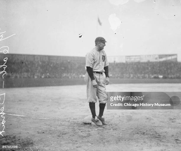 Informal full-length portrait of Hall of Fame baseball player Ty Cobb of the American League's Detroit Tigers baseball team, smiling while standing...