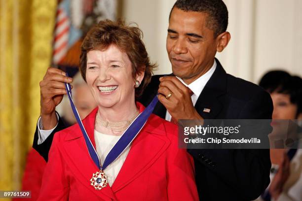 President Barack Obama presents the Medal of Freedom to former President of Ireland Mary Robinson during a ceremony in the East Room of the White...