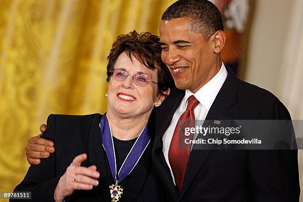 President Barack Obama embraces tennis champion Billie Jean King after presenting her with the Medal of Freedom during a ceremony in the East Room of...