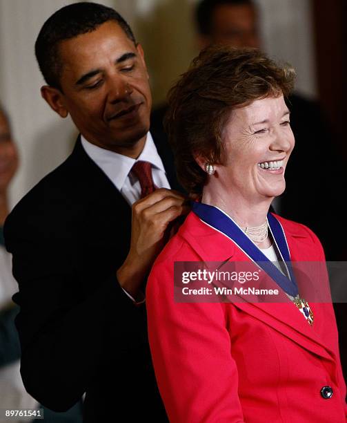 President Barack Obama presents the Medal of Freedom to former Irish President Mary Robinson during a ceremony at the White House August 12, 2009 in...