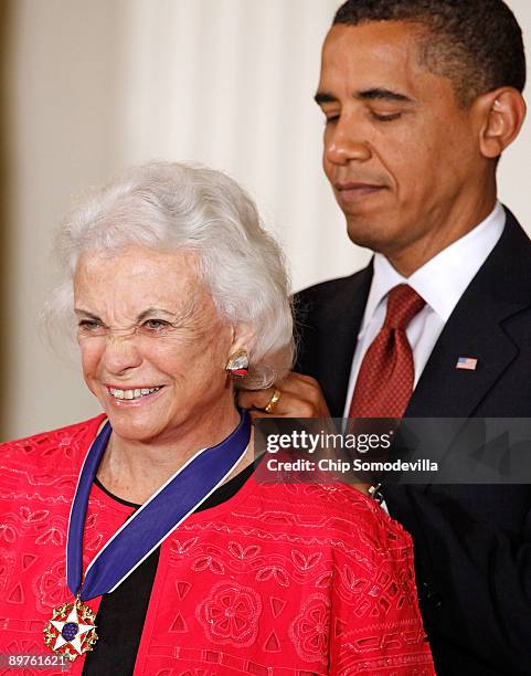 President Barack Obama presents the Medal of Freedom to retired Supreme Court Justice Sandra Day O'Connor during a ceremony in the East Room of the...