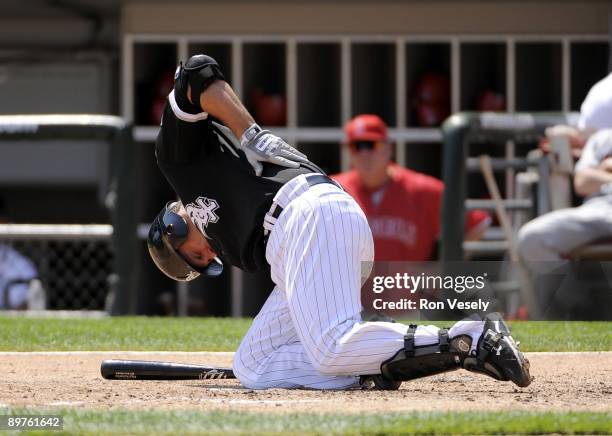 Paul Konerko of the Chicago White Sox falls to the ground after being hit by a pitch against the Los Angeles Angels on Thursday, August 6, 2009 at...