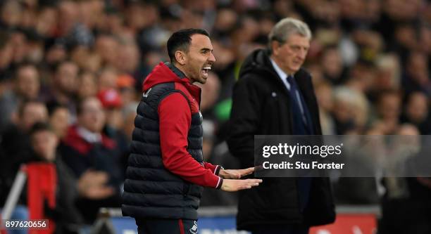 Swansea caretaker manager Leon Britton reacts as Roy Hodgson looks on during the Premier League match between Swansea City and Crystal Palace at...