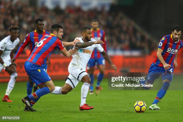 Luciano Narsingh of Swansea City attempts to get past Scott Dann of Crystal Palace during the Premier League match between Swansea City and Crystal...